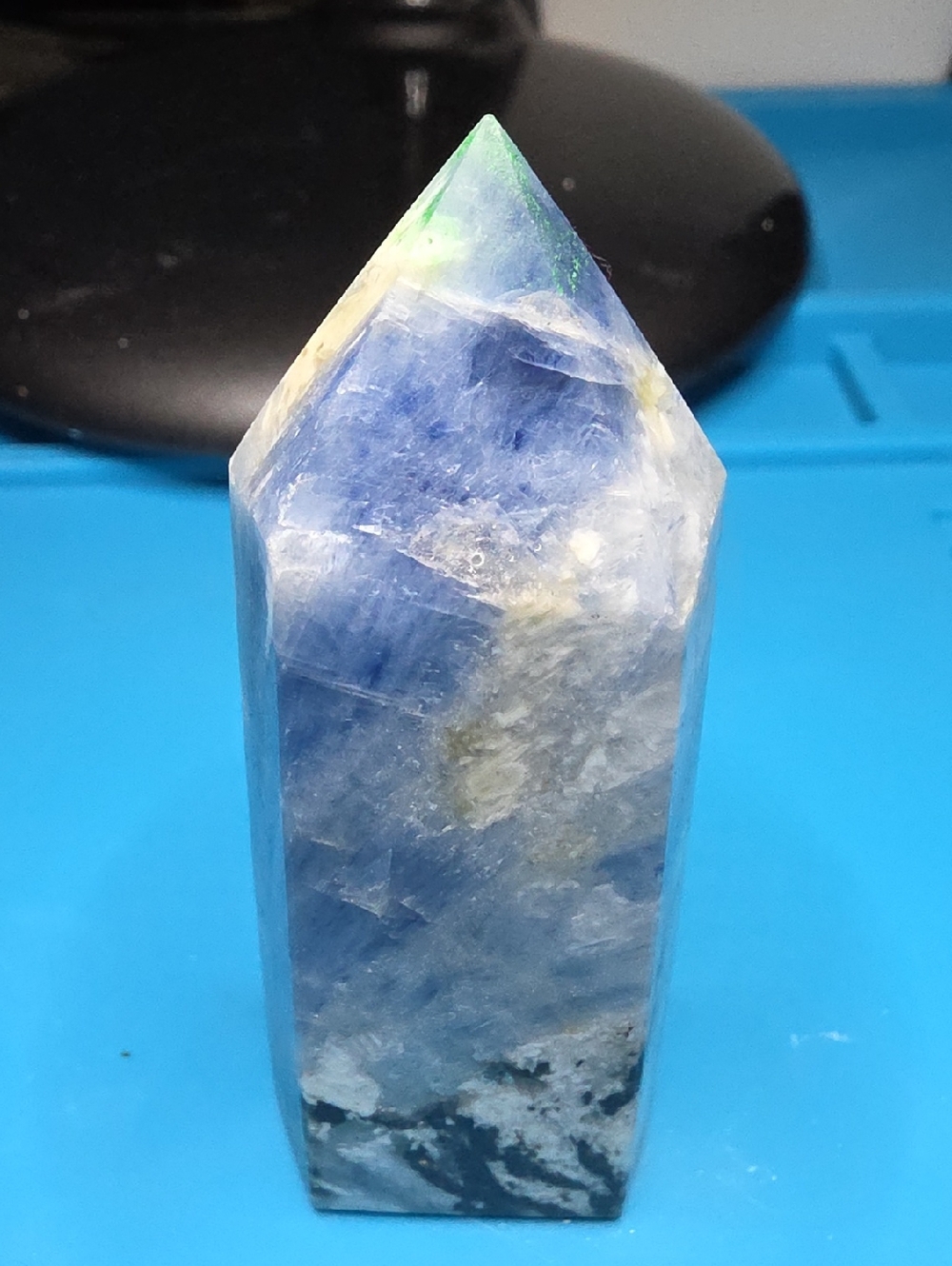 Blue Kyanite crystal tower featuring white and black And Blue Inclusions.